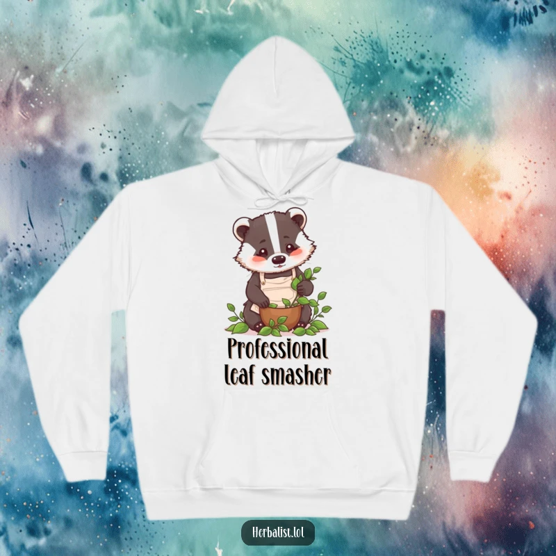 Funny badger chef hoodie, detailed apron, crushing leaves with focus, warm and humorous attire, great funny gift.